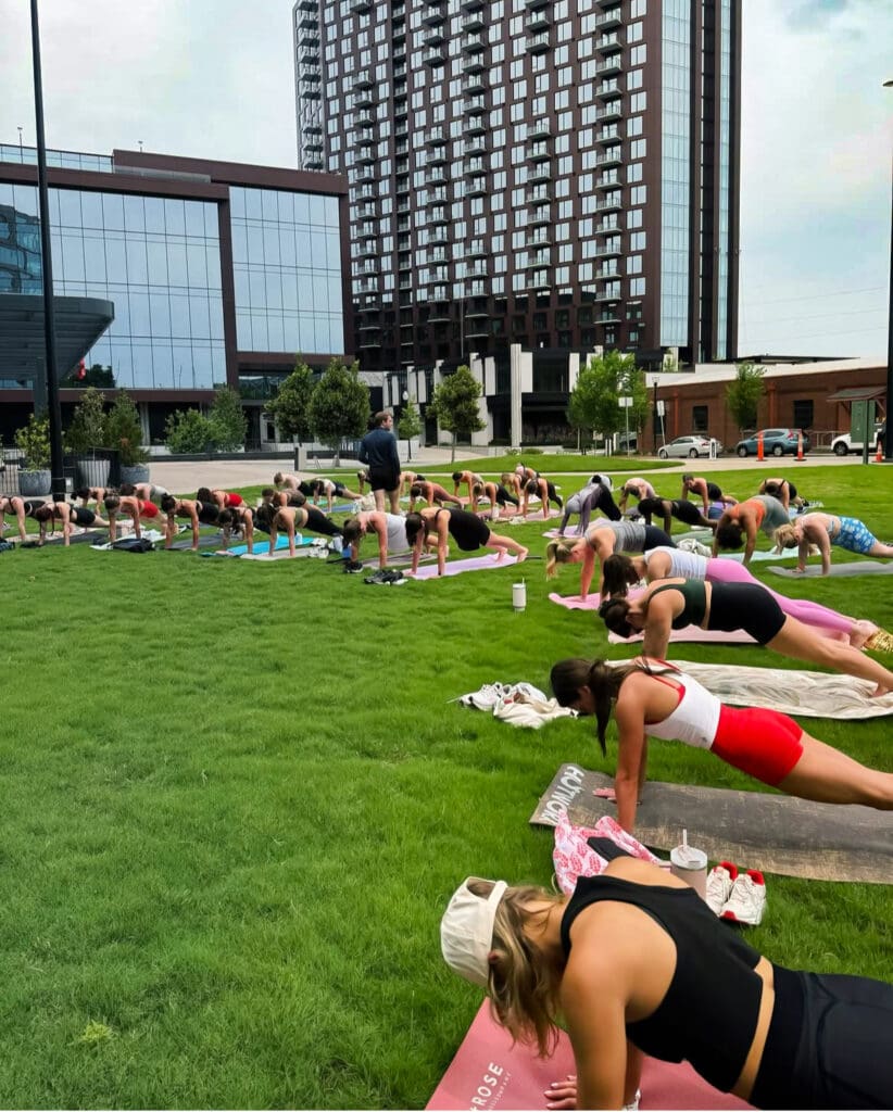 Yoga Community Class on the lawn at E+ROSE Peabody Plaza